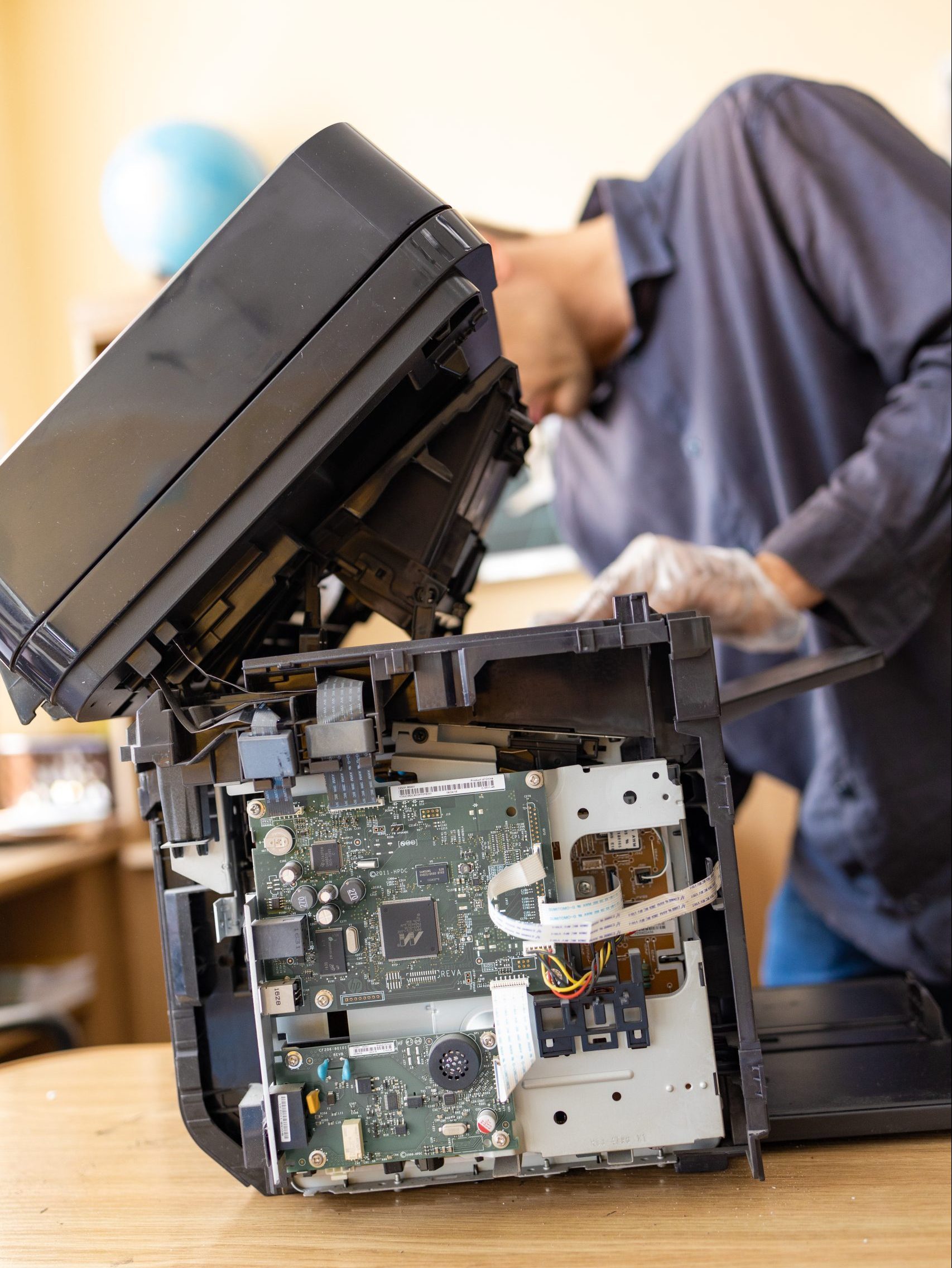 printer-repair-technician-a-male-handyman-inspect-2023-11-27-05-25-22-utc